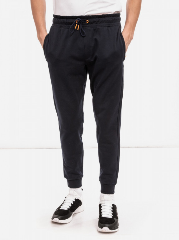 GUESS pánské tmavě modré tepláky ORGANIC COTTON SLIM FIT JOGGER č.1